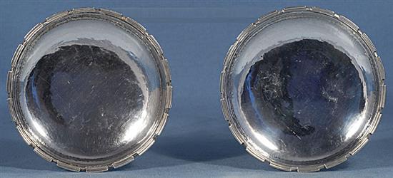 A pair of 1930s Arts & Crafts silver crenelated dishes, by Omar Ramsden, Diameter 4 ½”/114mm Combined weight 6.8oz/194grm